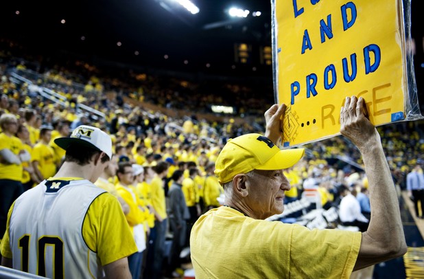 Michigan fan and Canton resident "True Blue" Tom Malden holds a sign before the game against Michigan State on Sunday, Mar. 3. Daniel Brenner I AnnArbor.com
